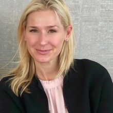 Head shot of Natalie Turvey against a grey background.