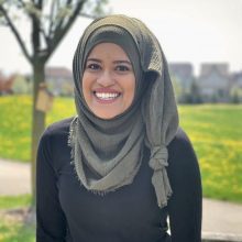 Close up of Maham Abedi in a park.